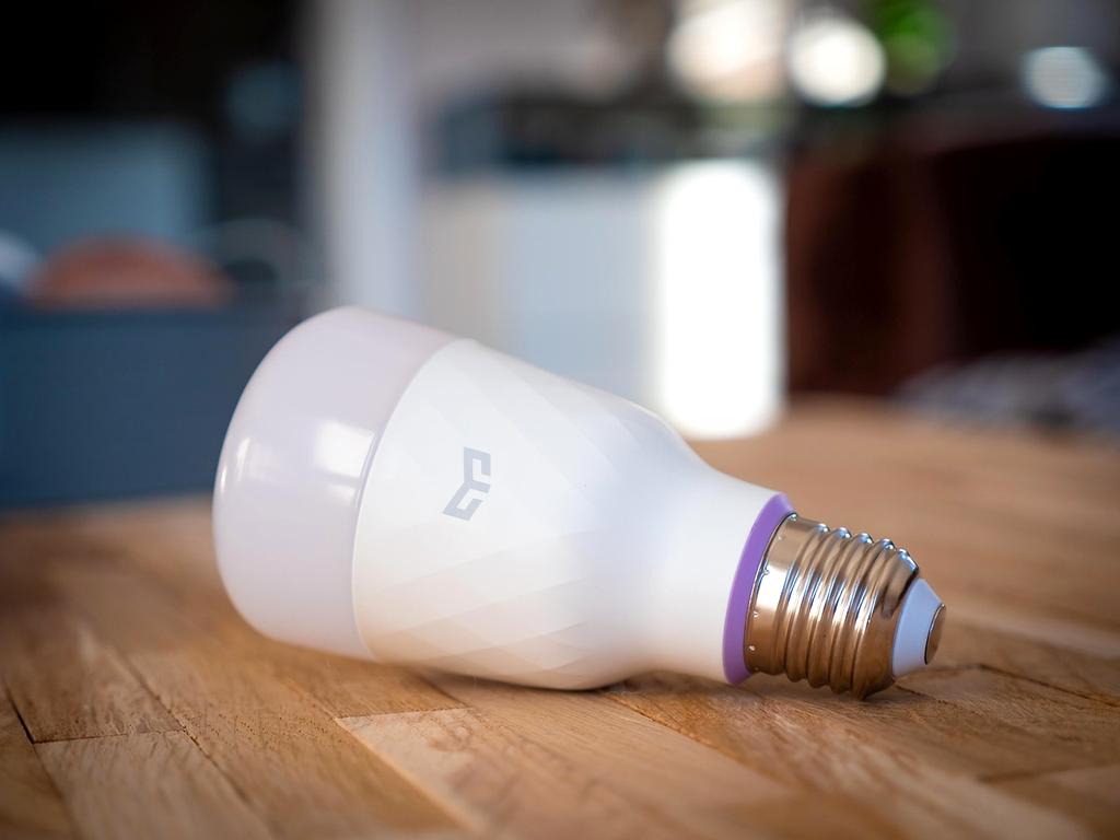 Voice-enabled smart speaker in stylish living room